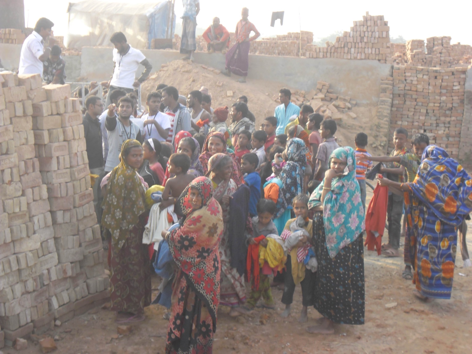 Volunteers distributing clothing to families in need